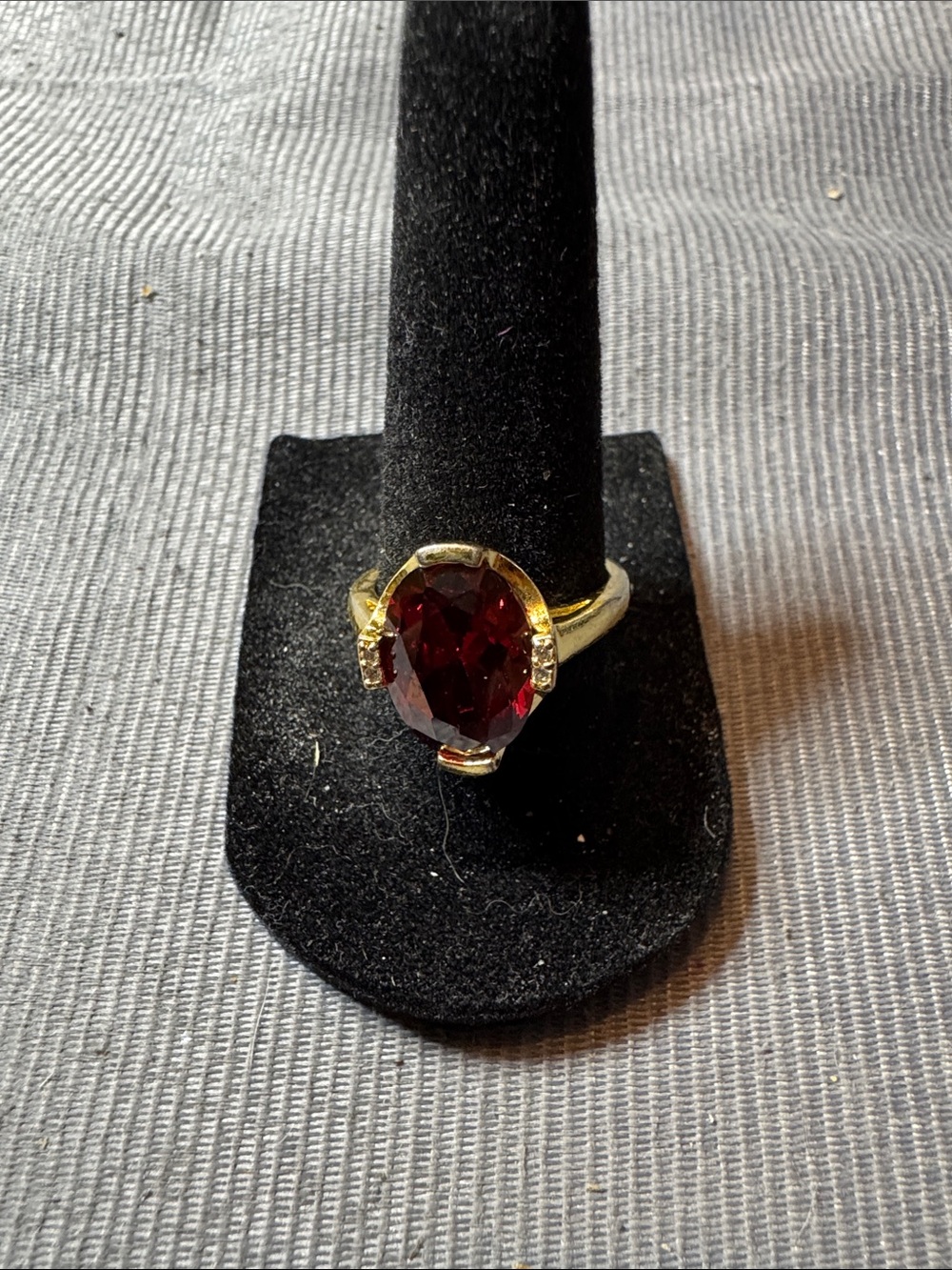 Vintage Source Unknown Gold-Tone Ring with Deep Red Oval Stone